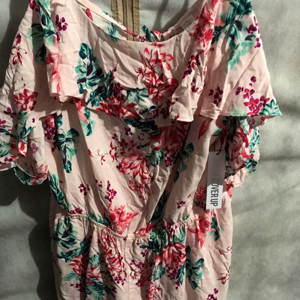 Pink romper with floral designs